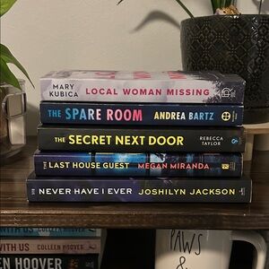 5 like new paper back books